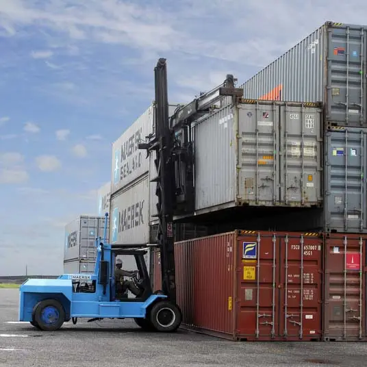 Large forklift lifting containers